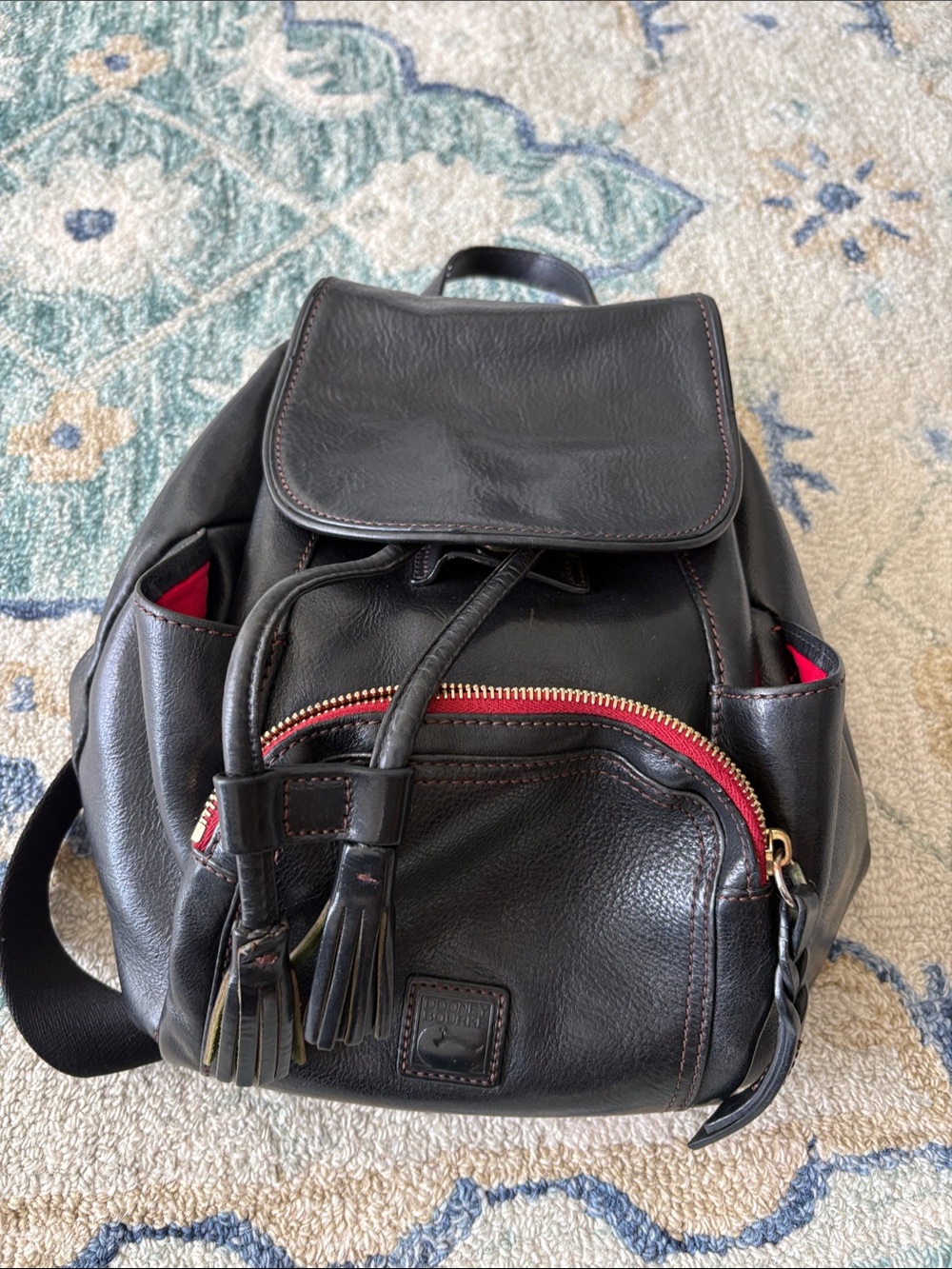 Dooney and Bourke Black Leather Backpack with Red Accents